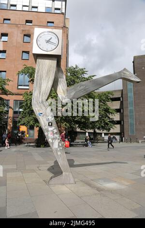 The Clyde Clock, Killermont Street, Glasgow, Scotland, UK. The cube shaped clock – perched on top of a pair of stainless steel legs, 20 feet high – reminds locals to run on time every single day. The iconic clock is actually a sculpture know as Running Time, and was created by the late George Wyllie, the Glasgow-born artist. George Wyllie passed away in May 2012, aged 90. In a superstitious turn of events, the Clyde Clock stopped working shortly after the artist’s death. Stock Photo