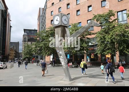 The Clyde Clock, Killermont Street, Glasgow, Scotland, UK. The cube shaped clock – perched on top of a pair of stainless steel legs, 20 feet high – reminds locals to run on time every single day. The iconic clock is actually a sculpture know as Running Time, and was created by the late George Wyllie, the Glasgow-born artist. George Wyllie passed away in May 2012, aged 90. In a superstitious turn of events, the Clyde Clock stopped working shortly after the artist’s death. Stock Photo