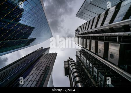 Looking up to London's skyscrapers, Lloyd's building, The Leadenhall Building and The Scalpel; abstract futuristic city wallpaper Stock Photo