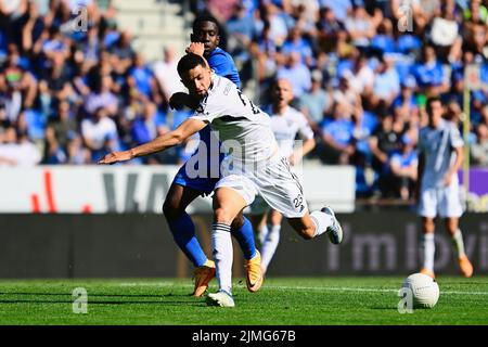Genk's Carlos Cuesta and Eupen's Isaac Christie-Davies fight for the ball during a soccer match between KRC Genk and KAS Eupen, Saturday 06 August 2022 in Genk, on day 3 of the 2022-2023 'Jupiler Pro League' first division of the Belgian championship. BELGA PHOTO JOHAN EYCKENS Stock Photo