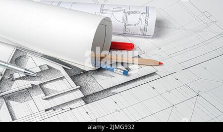 Architect workplace. Rolls of architecture blueprints and house plans Stock Photo