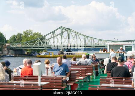 Excursion boat on the Havel River at Glienicke Bridge between Berlin and Potsdam Stock Photo
