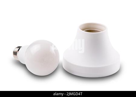 White led light bulb and white plastic socket isolated on white background. Stock Photo
