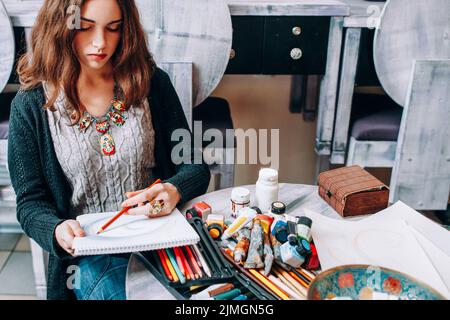 hobby talent lefthanded female artist draw studio Stock Photo
