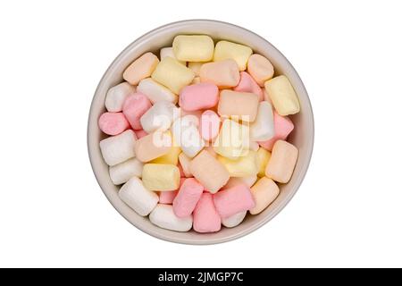 Top view of multicolored marshmallow in white ceramic cup. Stock Photo