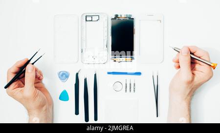 mobile phone repair parts replacing broken screen Stock Photo