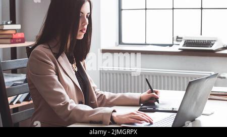 female designer editing artwork graphic tablet Stock Photo