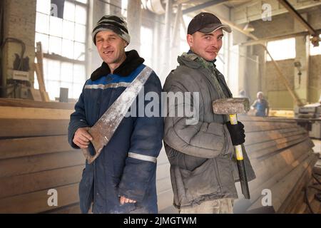 Two bad unskilled builder workers Stock Photo