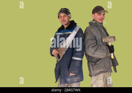 Two bad unskilled builder workers Stock Photo