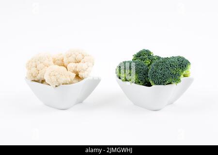 Fresh broccoli and cauliflower in a porcelain bowls Stock Photo