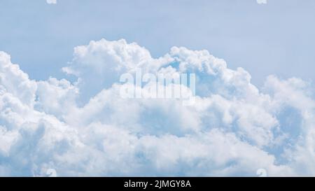 Light blue cumulus clouds texture, wide summer sky background Stock Photo
