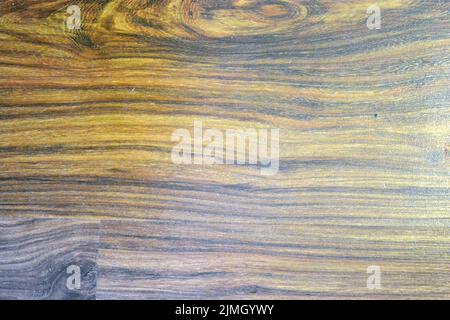 Interesting and intriguing wooden background with an pattern, textured lines. Stock Photo