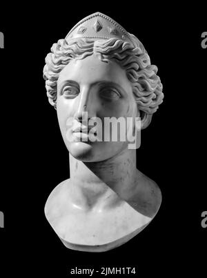Gypsum copy of ancient statue Venus head isolated on black background. Plaster sculpture woman face Stock Photo