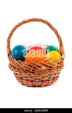 Easter eggs in a basket on a white background Stock Photo