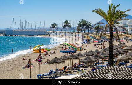 MARBELLA, ANDALUCIA/SPAIN - MAY 4 : View of the beach at Marbella Spain on May 4, 2014. Unidentified people. Stock Photo