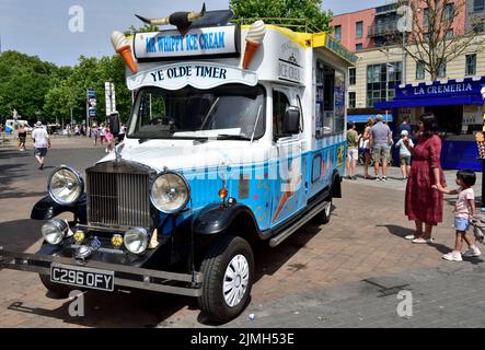 Classic Ice Cream Van In Pink With Disney Characters On It Waiting For classic-ice-cream-van-in-pink-with-disney-characters-on-it-waiting-for