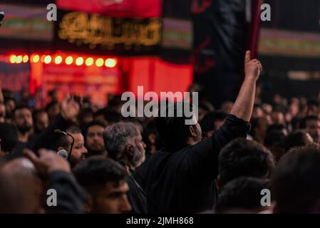 A Shia Muslim man recite religious slogans during a procession on the ...