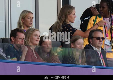 EDITORS NOTE Children's faces have been pixelated as the PA Picture Desk has been unable to gain the necessary permission to photograph a child under 16. Liz Truss with West Midlands Mayor Andy Street (left) at Alexander Stadium to watch the athletics, with her daughters Frances, 16, and Liberty, 13, and husband Hugh O'Leary on day nine of the 2022 Commonwealth Games in Birmingham. Picture date: Saturday August 6, 2022. Stock Photo