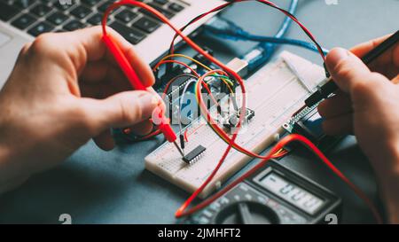 engineer workplace testing electronic components Stock Photo