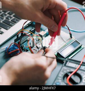 engineer workplace testing electronic components Stock Photo