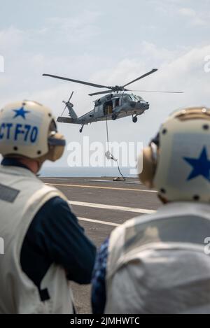 Rear Adm. Michael Donnelly, commander of the carrier strike group ...