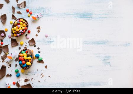 Cute bunnies near easter sweets Stock Photo