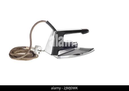 An old, classic electric iron for ironing, isolated on a white background with a clipping path Stock Photo