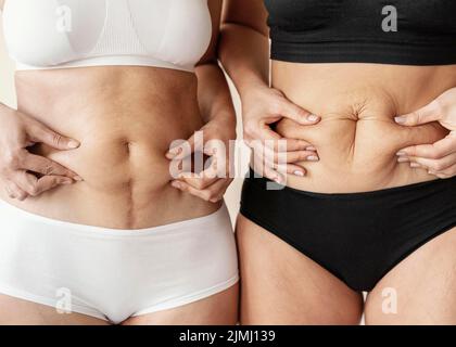 Close up women holding belly Stock Photo