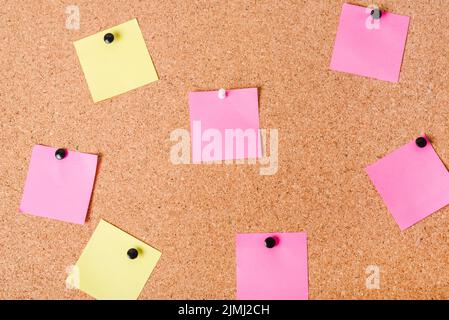 Close up corkboard with various note papers Stock Photo