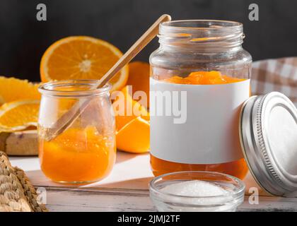 Front view transparent jar with orange jam Stock Photo