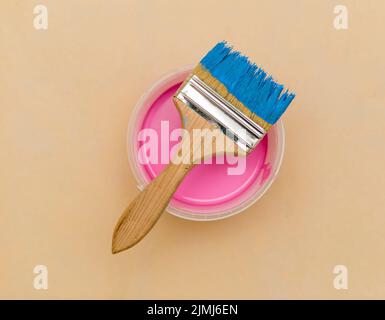 Flat lay blue brush pink paint bucket Stock Photo