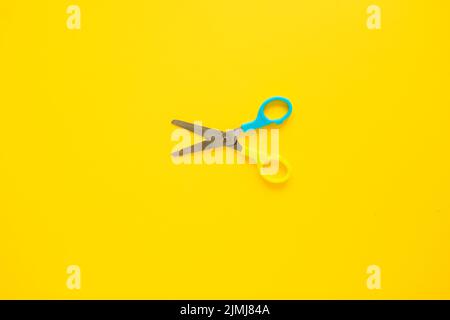 Opened scissors laid middle Stock Photo
