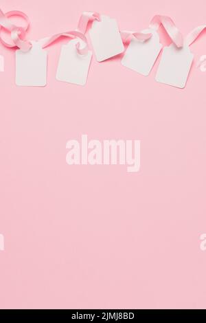 Pink Tag Background White tags pink ribbon top background with space text Stock Photo - Alamy