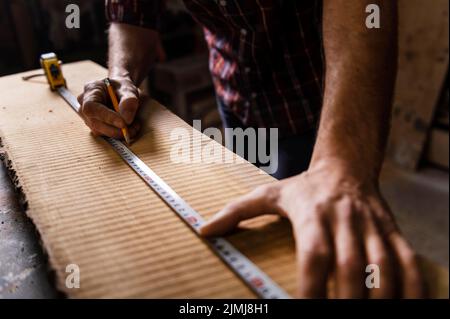 Close up man working with wood Stock Photo