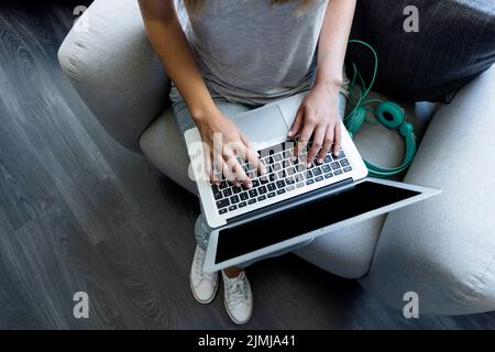 Young woman typing laptop Stock Photo