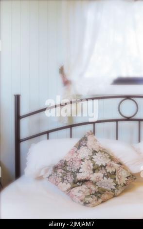 Pillows on bed in white bedroom Stock Photo