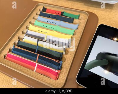Paris, France - Mar 18, 2022: Colorful Apple Watch bands for sale inside Apple Store Stock Photo