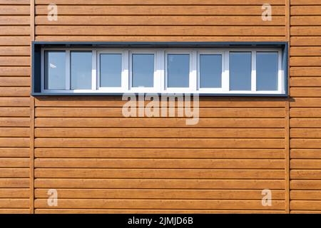 Wooden wall background with small windows. Light wood pattern. Modern wood template. Horizontal wooden volume planks Stock Photo
