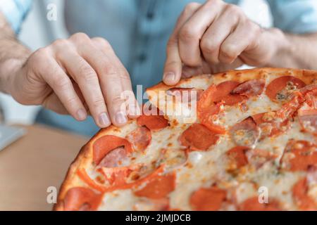 Businesspeople lunch break eating pizza close up Stock Photo