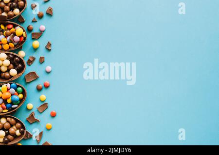 Halves chocolate eggs with sweets Stock Photo