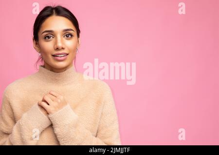 Portrait shot of beautiful attractive wonderful pretty nice cute charming positive cheerful cute young brunette woman in casual Stock Photo