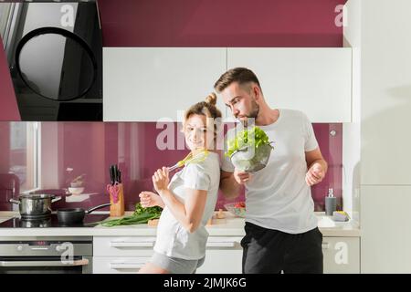 Happy couple indoors kitchen Stock Photo