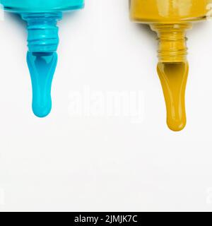Top view spilled nail polish white backdrop Stock Photo