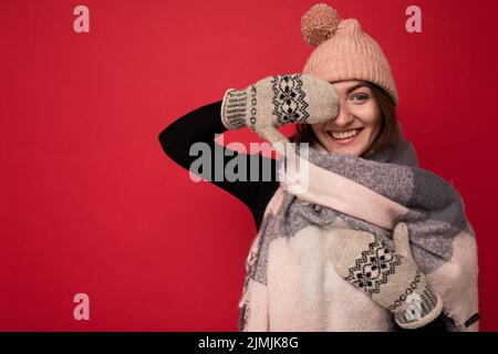 Photo of cute nice winsome positive adult woman wearing casual outfit isolated on background wall with copy space. Winter concep Stock Photo