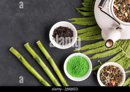 Collection aromatic dry tea ingredient black surface Stock Photo