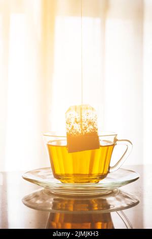 Tea bag inside cup Stock Photo