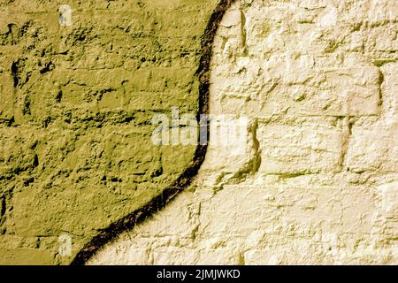 Brick wall painted yellow. Background texture. Stock Photo