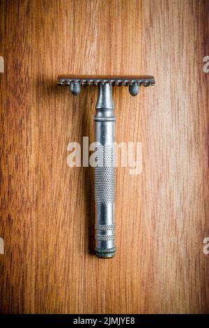 Old vintage shaver on a wooden background Stock Photo
