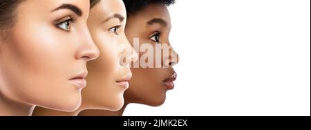 Different ethnicity women - Caucasian, African and Asian. Stock Photo