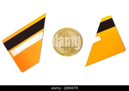 Bitcoin and broken credit card on white background Stock Photo